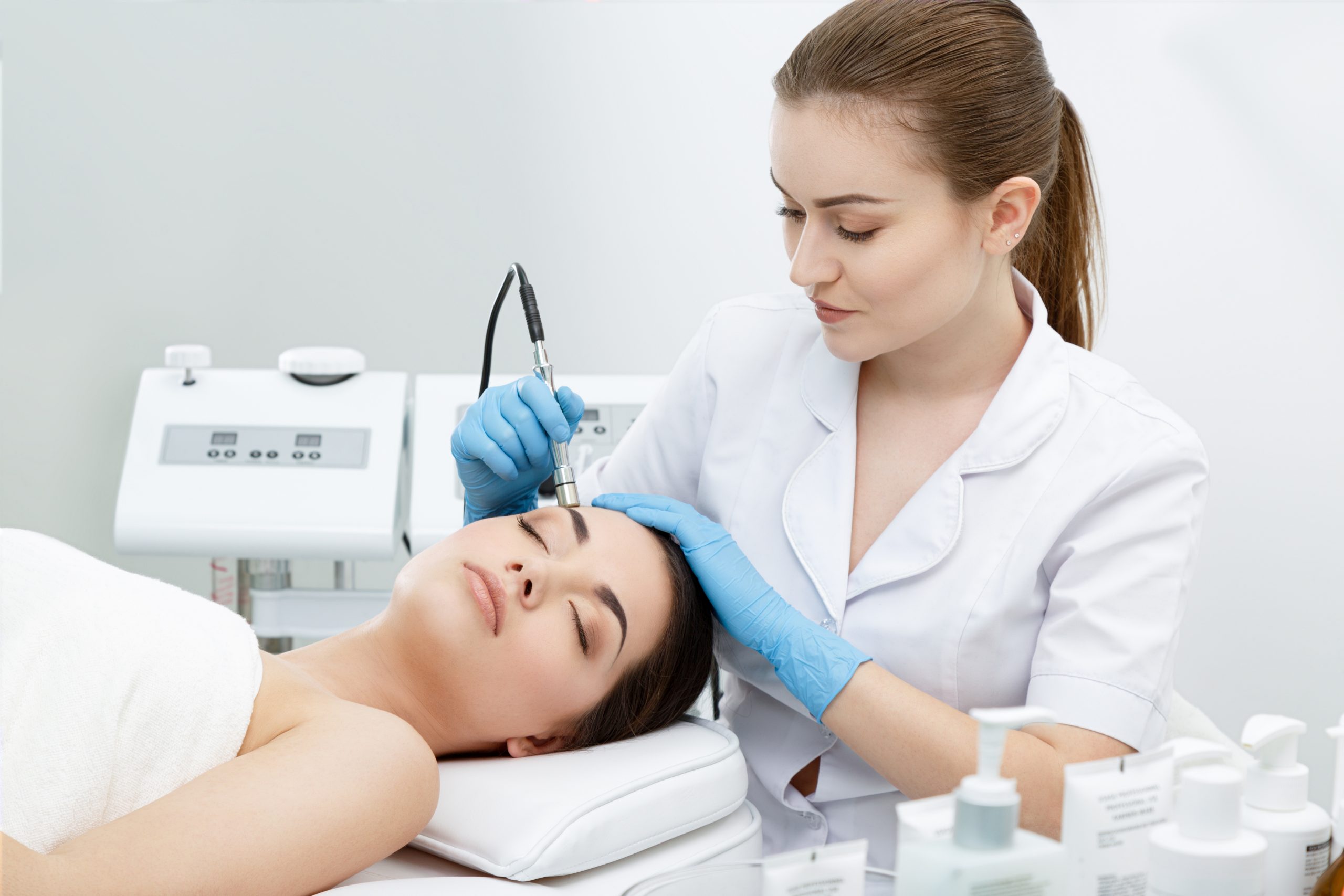 Woman undergoing laser treatment for acne scars at Lynn Medical